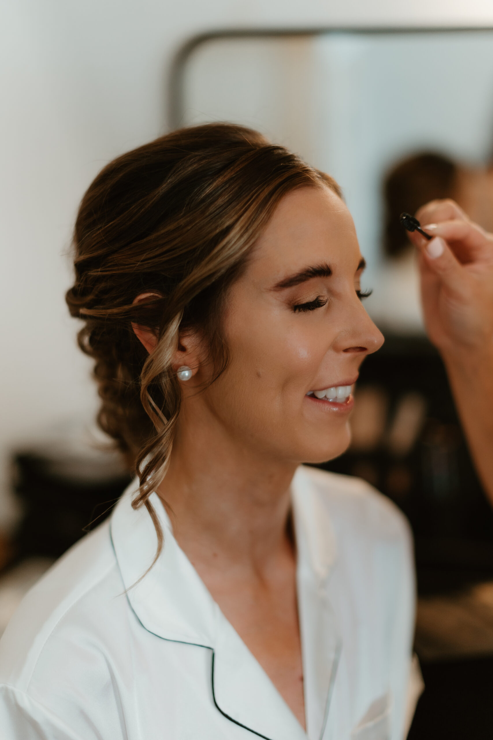 bride getting her make up done