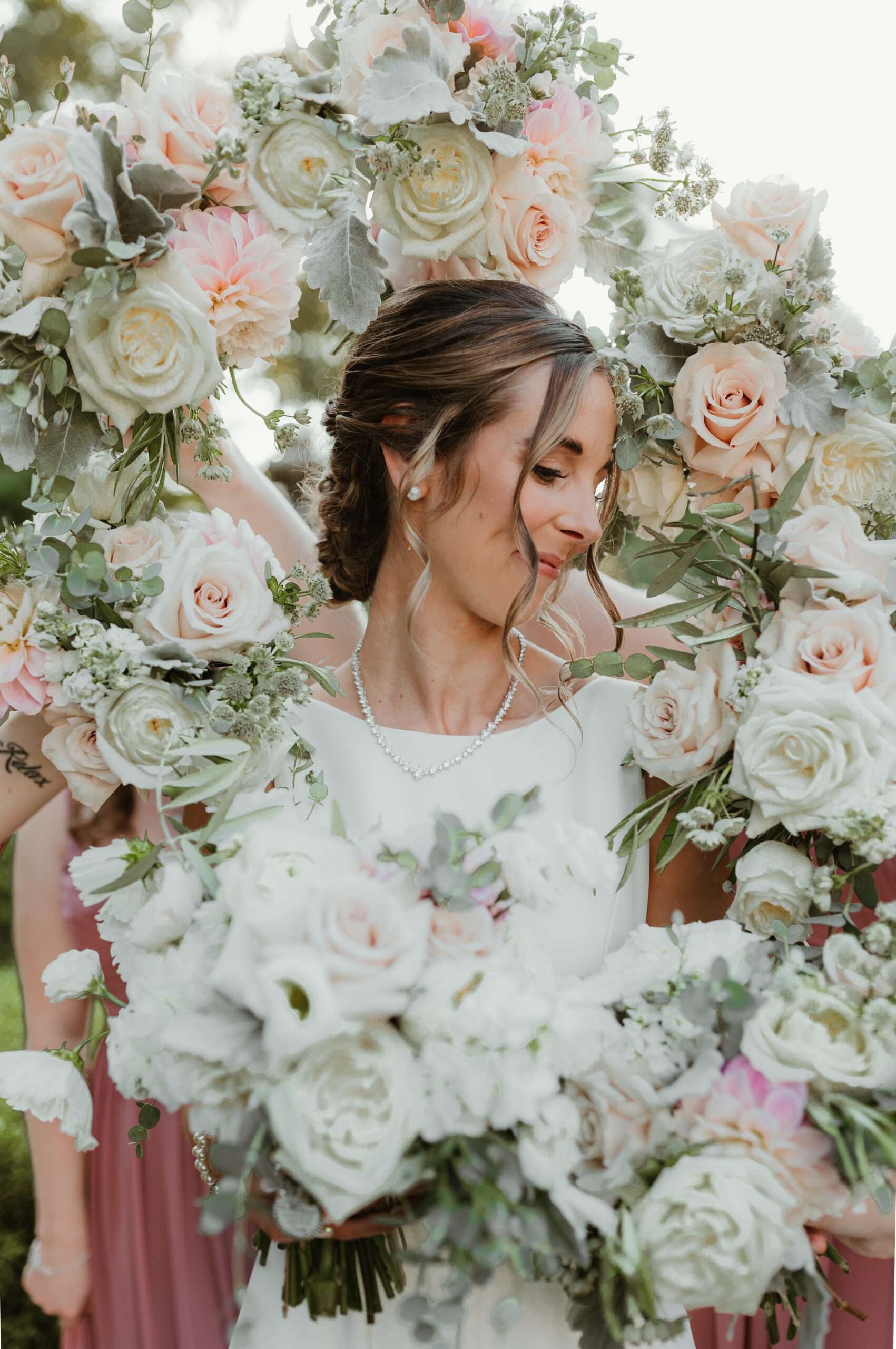 bride surrounded by flowers