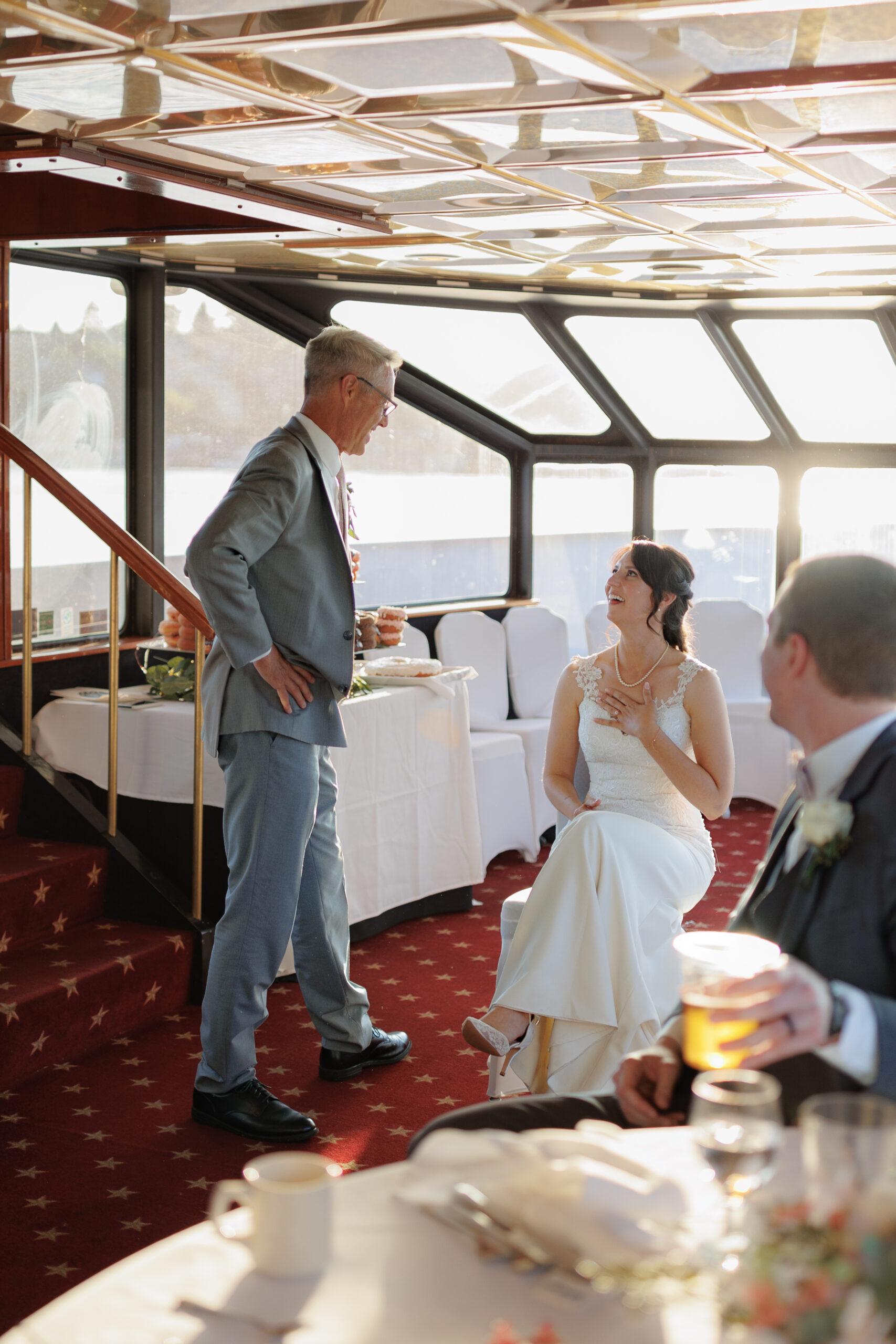 father singing to his daughter on a yacht