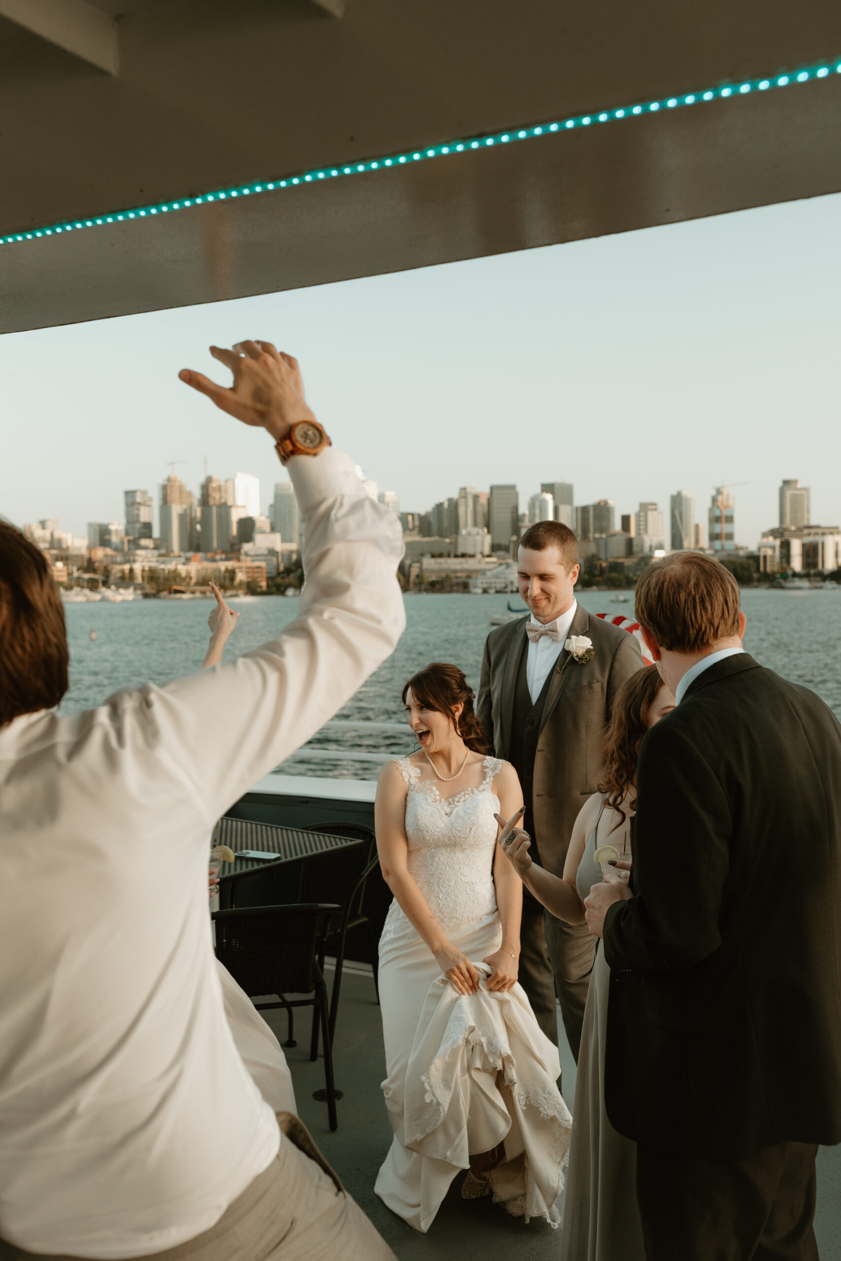 bride a groom dancing with seattle skyline