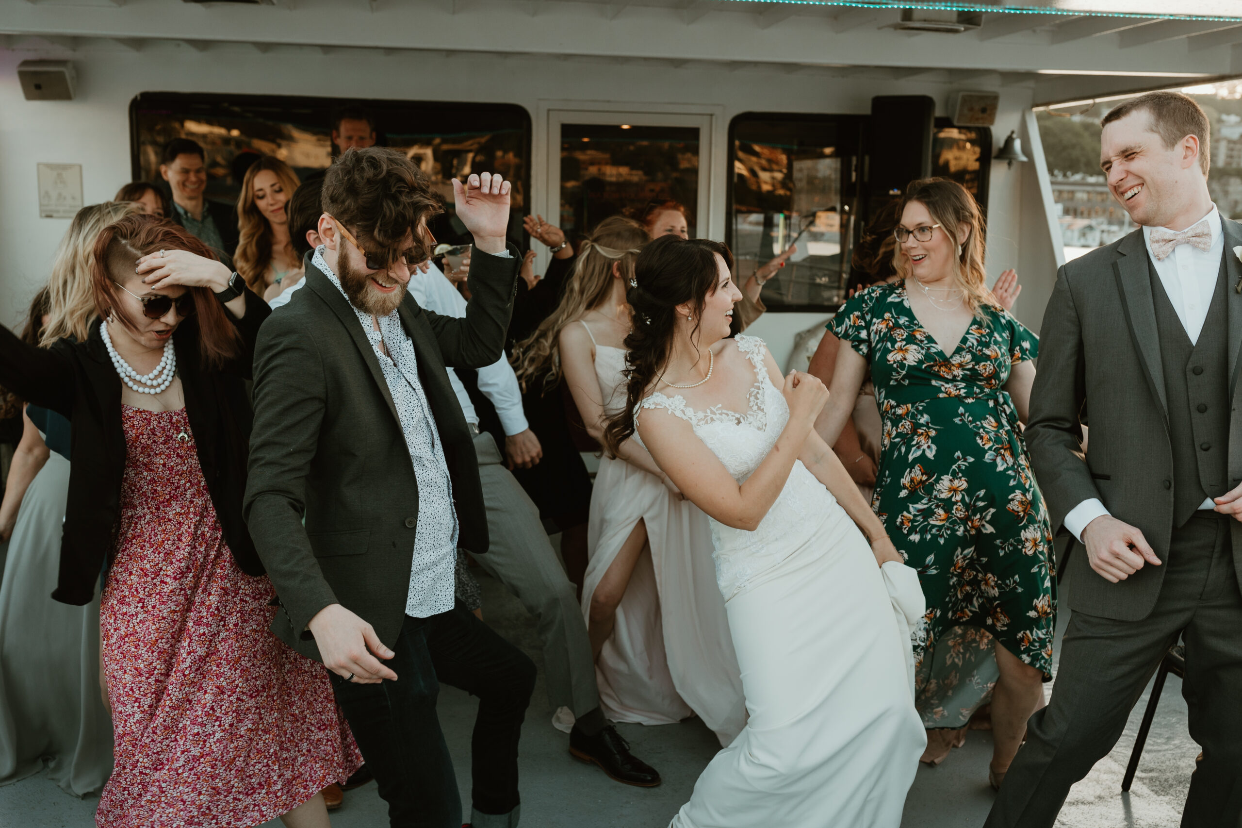 bride and her guests dancing at a reception