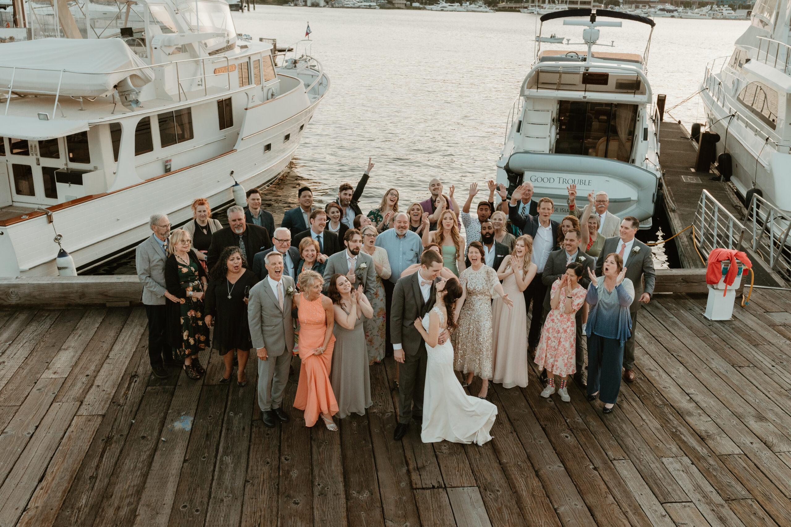 a group of people celebrating a wedding
