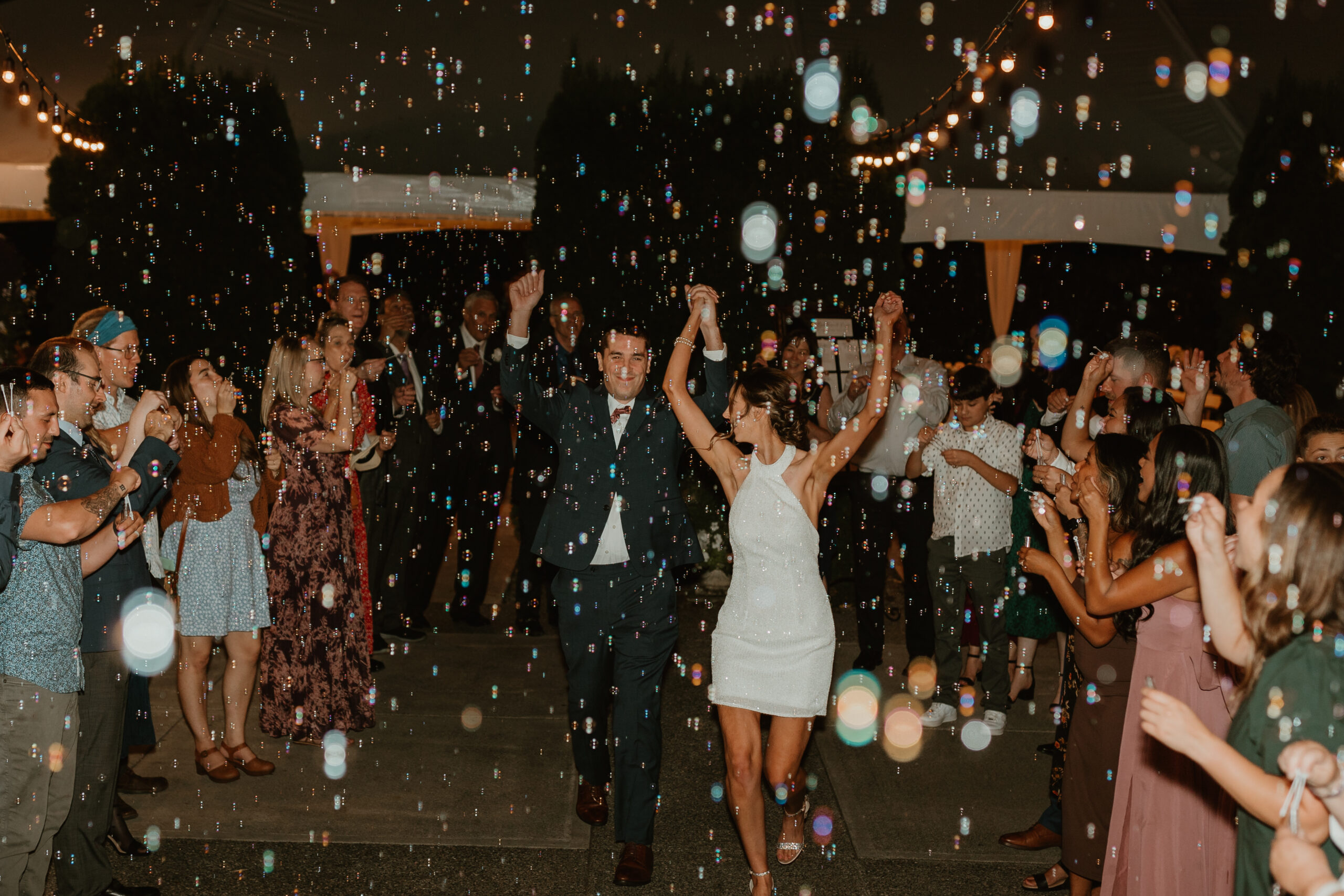bride and groom during a bubble exit