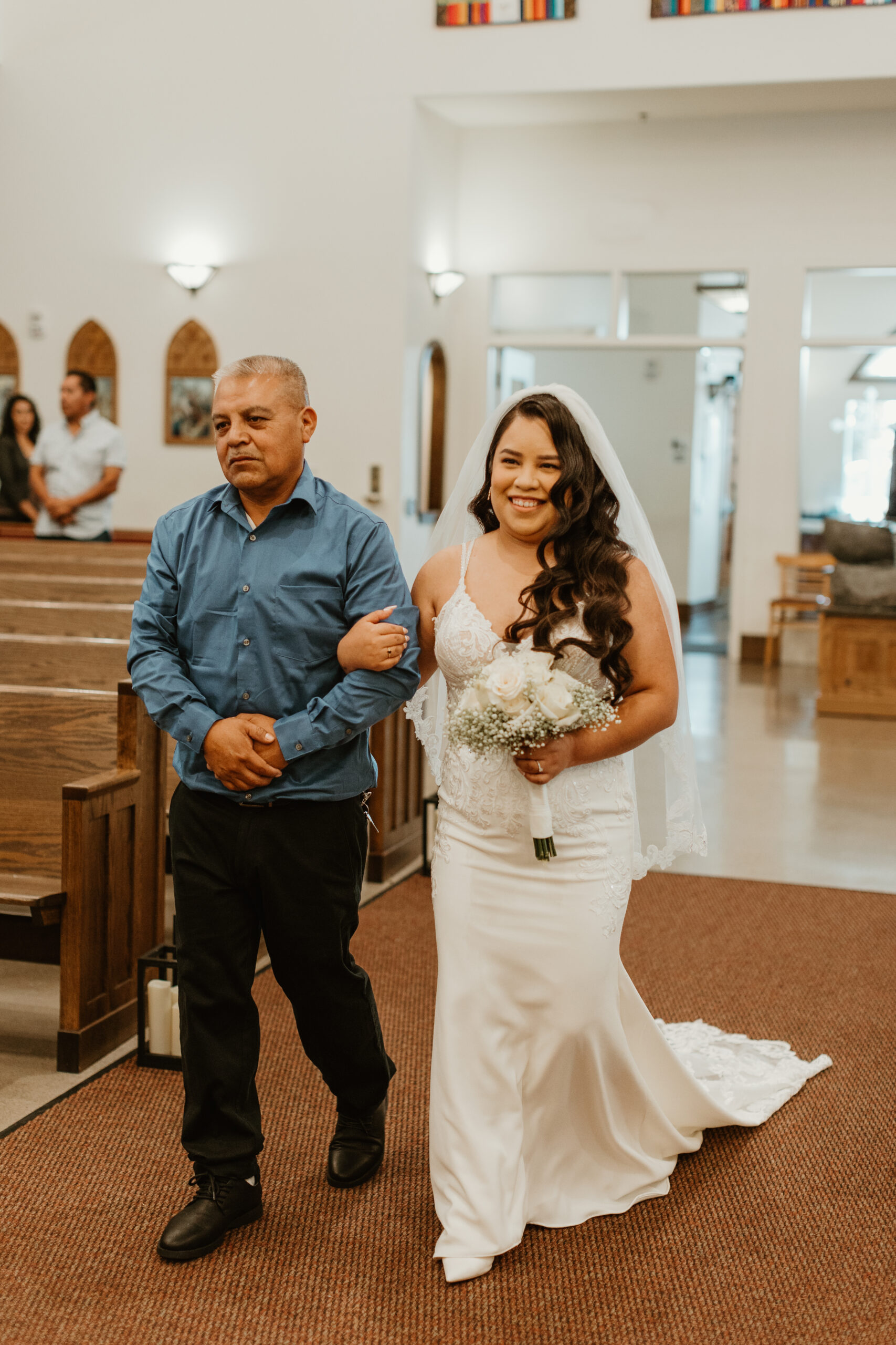 father walking a bride down the aisle