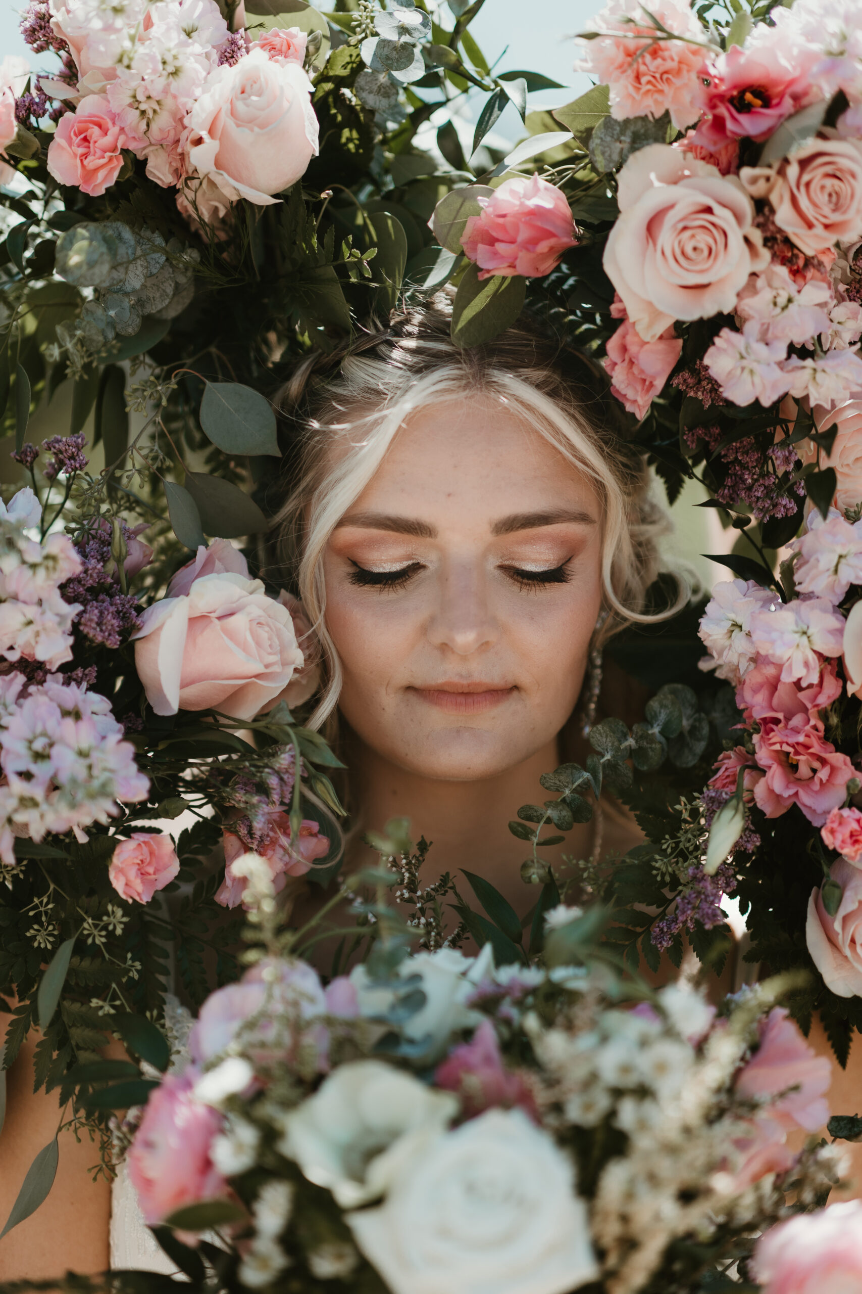 bride in the middle of flower bouquet