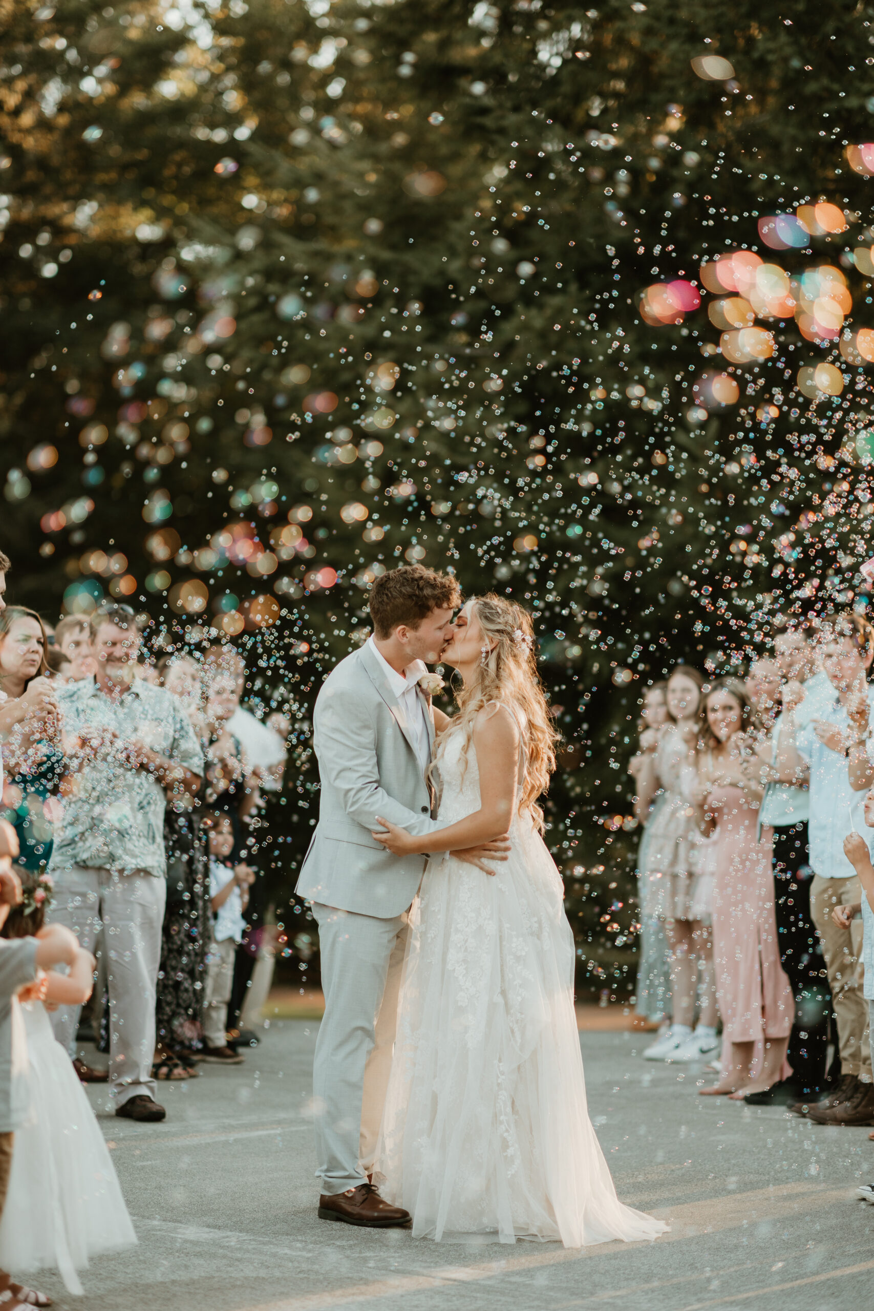 bride and groom kissing in bubbles in eatonville washington