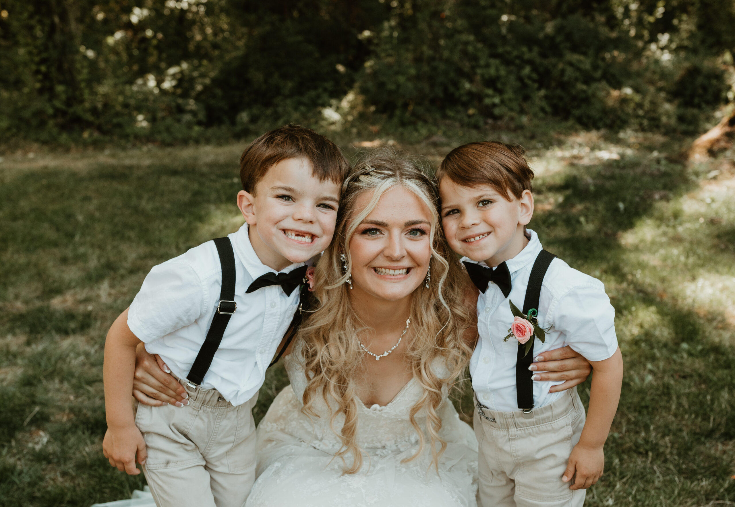 bride and her ring bearers on her wedding day
