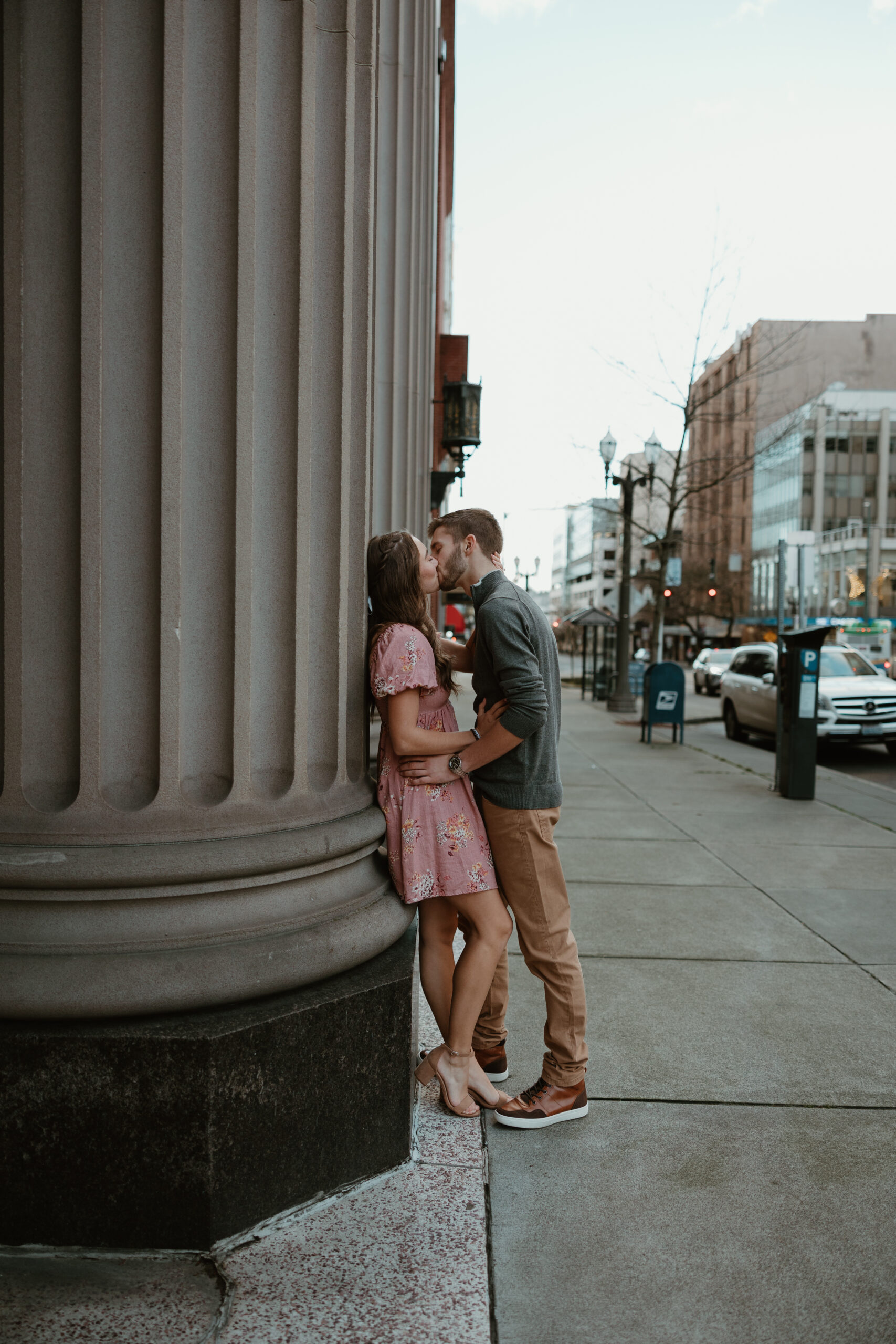 boy and girl kissing in the city